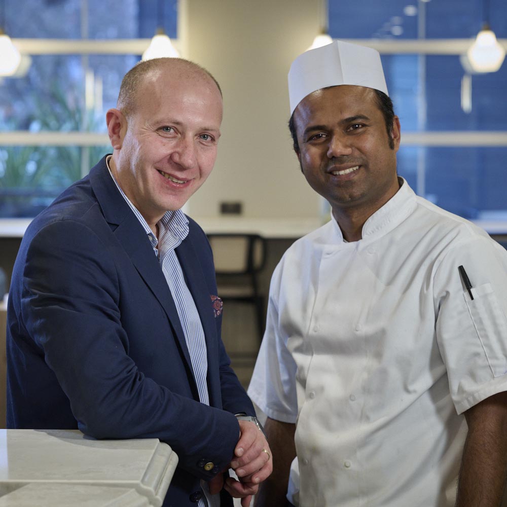 chef and his manager discuss the menu