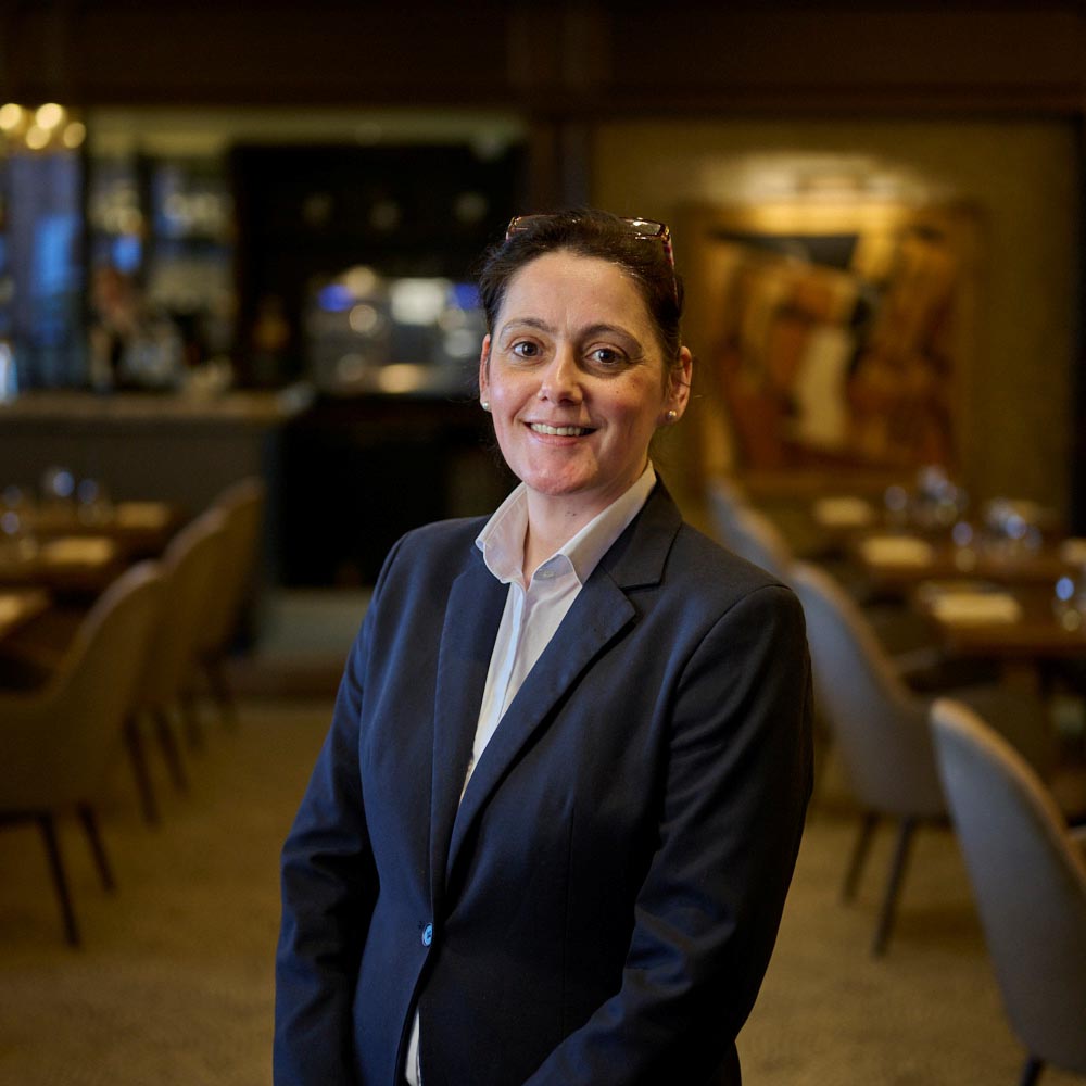 lady smiles in a restaurant